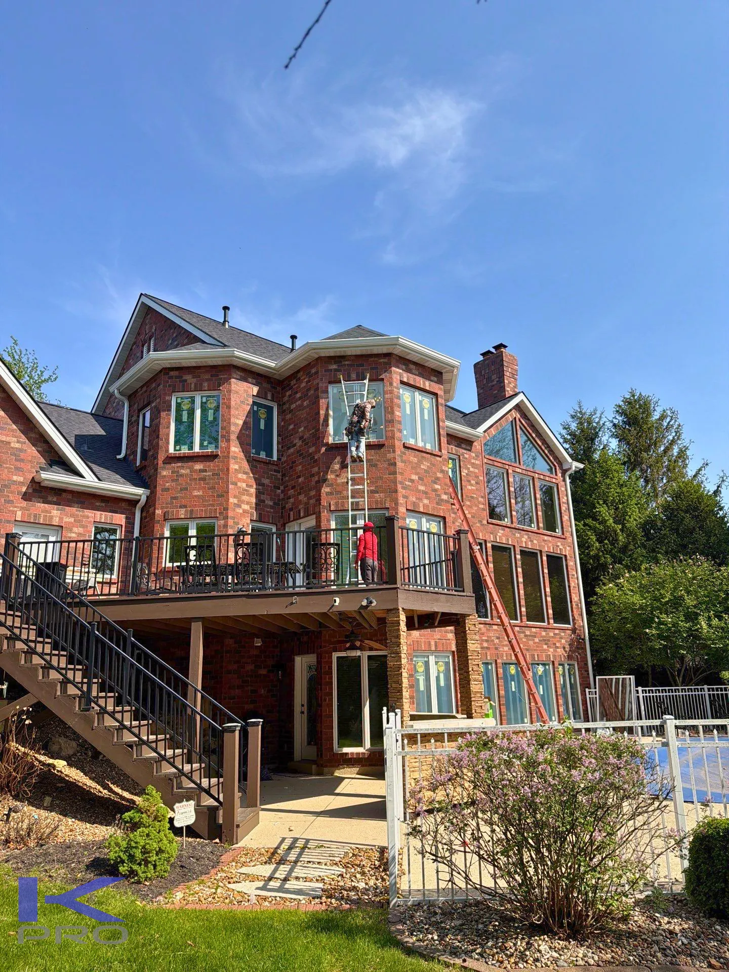 KPro Pella estate window package complete with deck and pool view